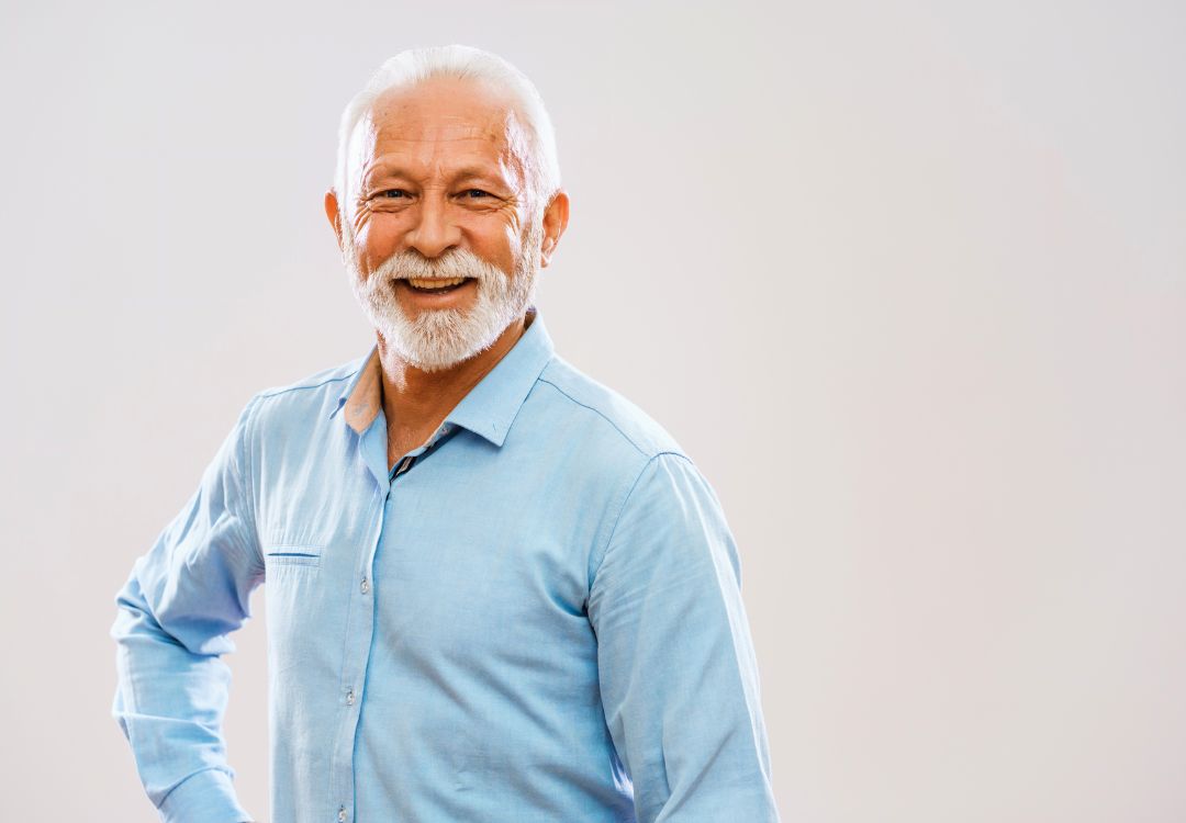 Confident smiling mature male student representing natural health programs success at KCNH