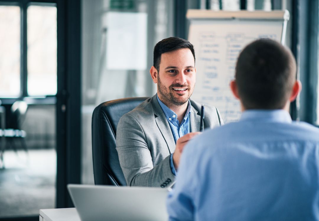 Two professionals in consultation meeting discussing natural health certificate program options